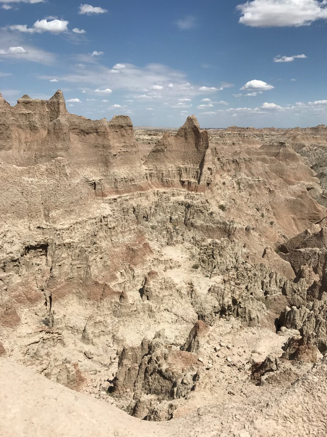 Layered rock formations and steep eroded ridges in the Badlands